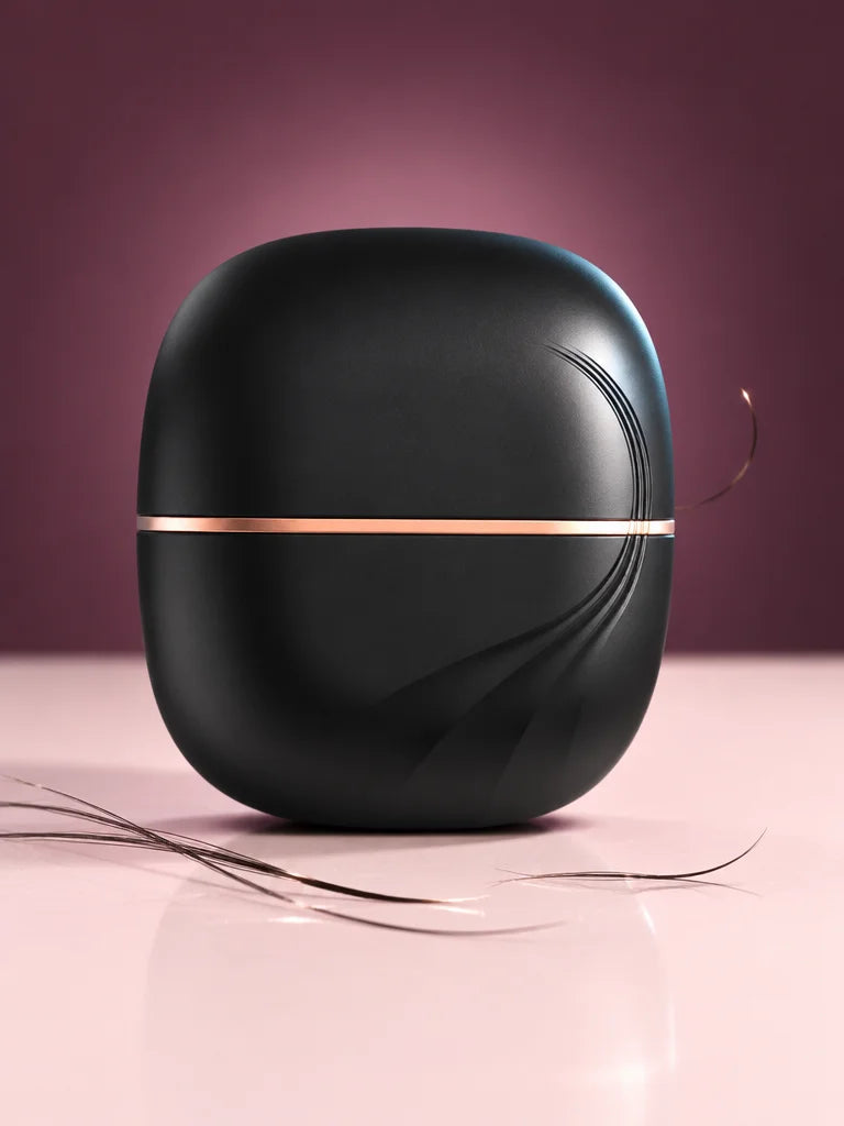 A constructed studio image of the exact closed black Lunéa mini smoothing comb from reference r03, r